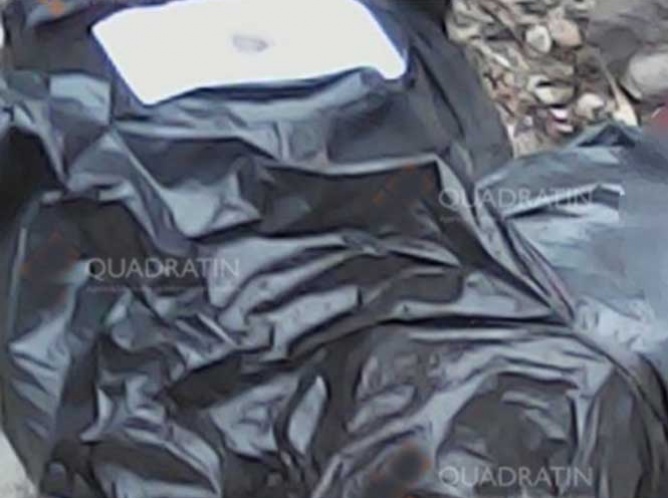 Hallan bolsas con restos humanos en Michoacán